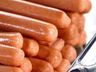 hot dogs in a clear, glass baking dish