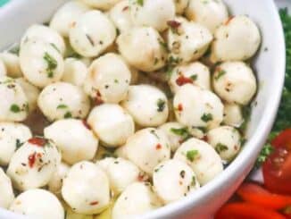 Low Sodium Marinated Mozzarella Balls in a white oval bowl