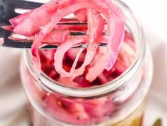pickled onions on a fork