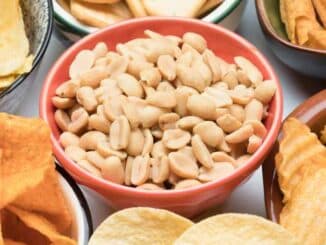 assorted snacks in small bowls