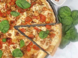 Overhead shot of a slice of chicken Margherita pizza