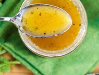 spoonful of salad dressing over small jar