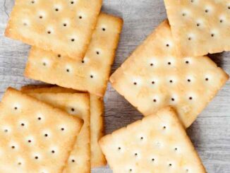 saltine crackers on a grey surface